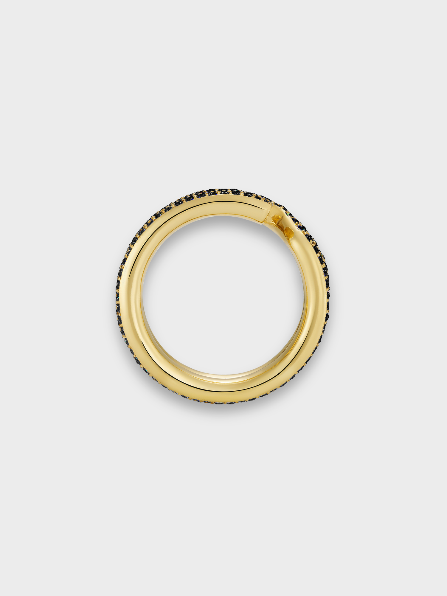 Gold keyring ring with black diamond pave on light grey background