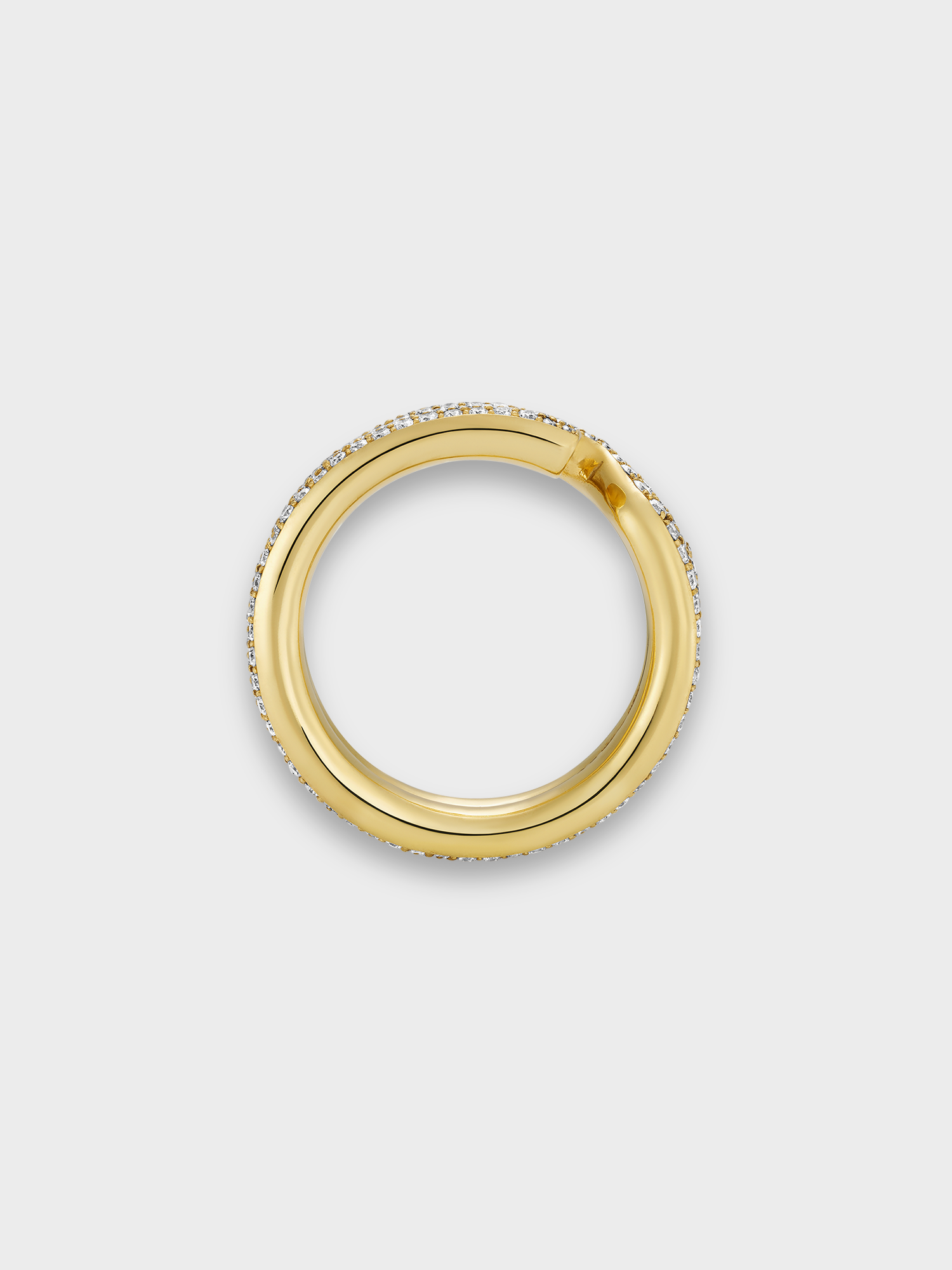 gold keyring ring with white diamond pave on light grey background