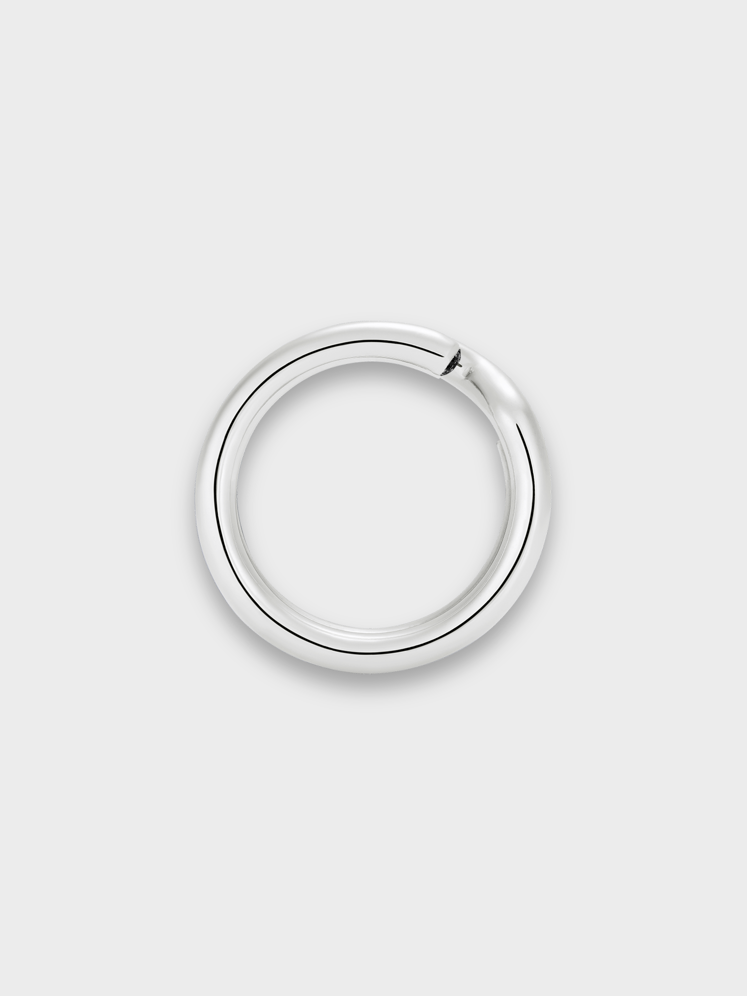 Silver keyring ring with black diamond end stones on light grey background