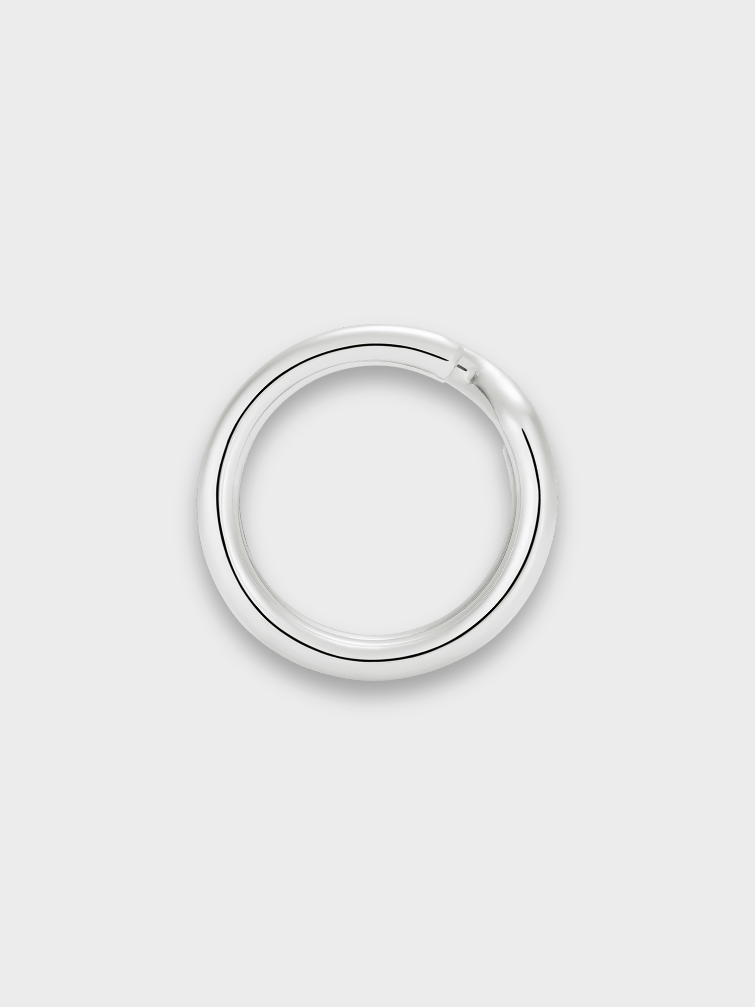 Silver keyring ring on a light grey background