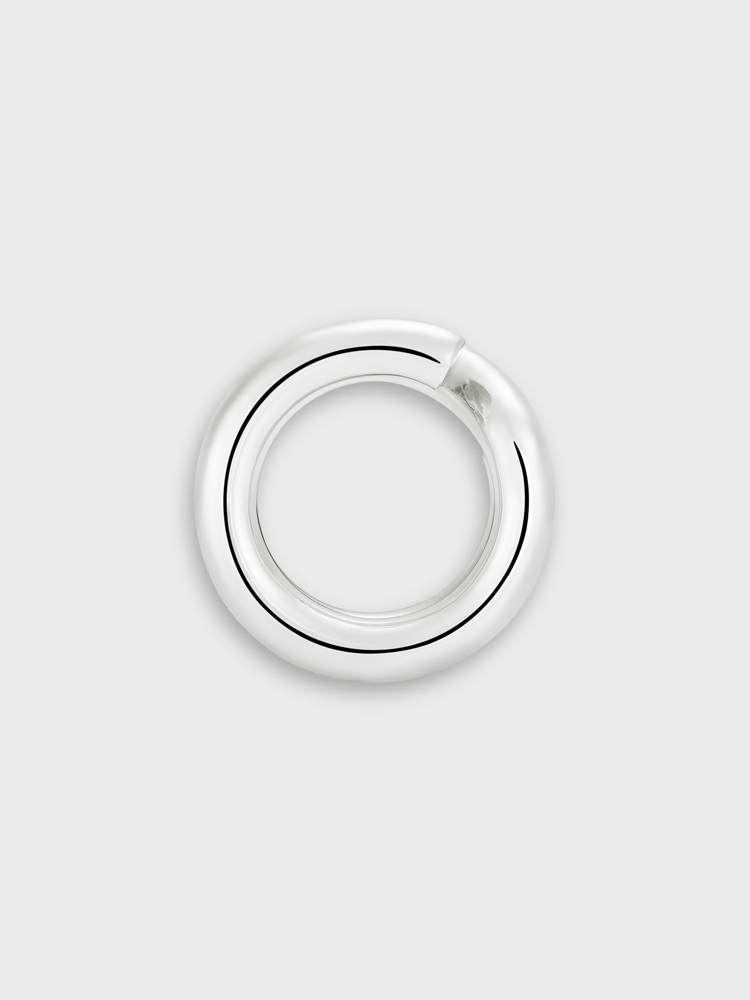 Silver keyring ring on a light grey background