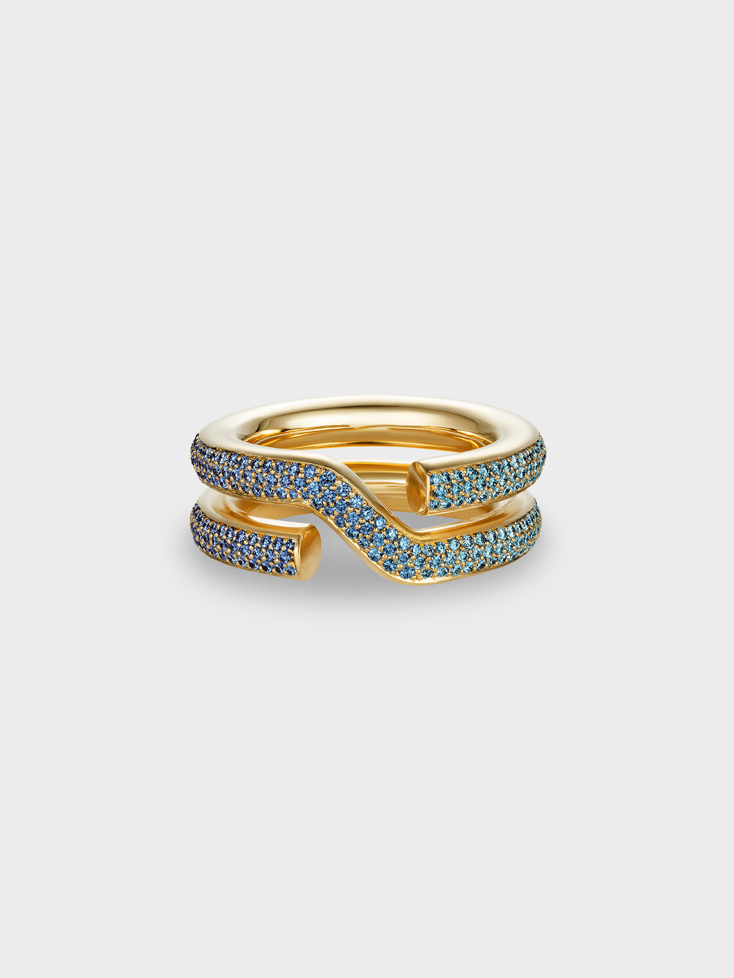 Gold keyring ring with sapphire pave on a light gray background